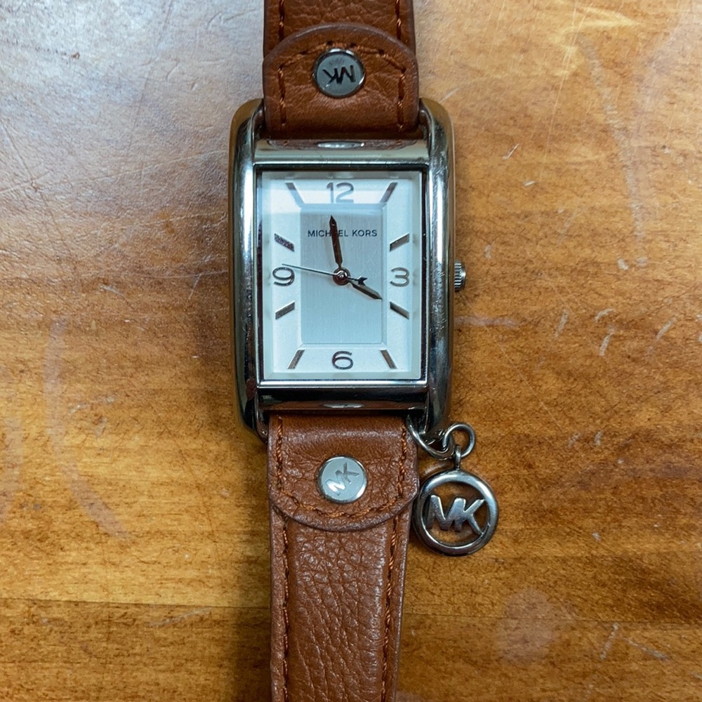 Michael Kors leather band women’s watch with charm